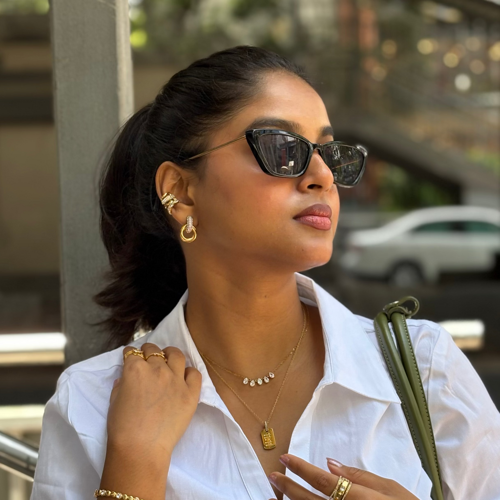 Bella Sparkle Hoops styled outdoors with layered necklaces, capturing an elegant everyday look in India.