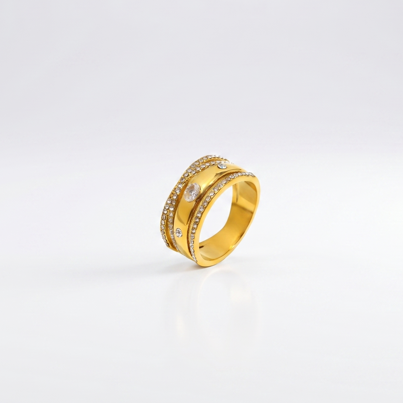 Bling It Ring product flatlay showing the 18K gold-plated layered design with clear stones.