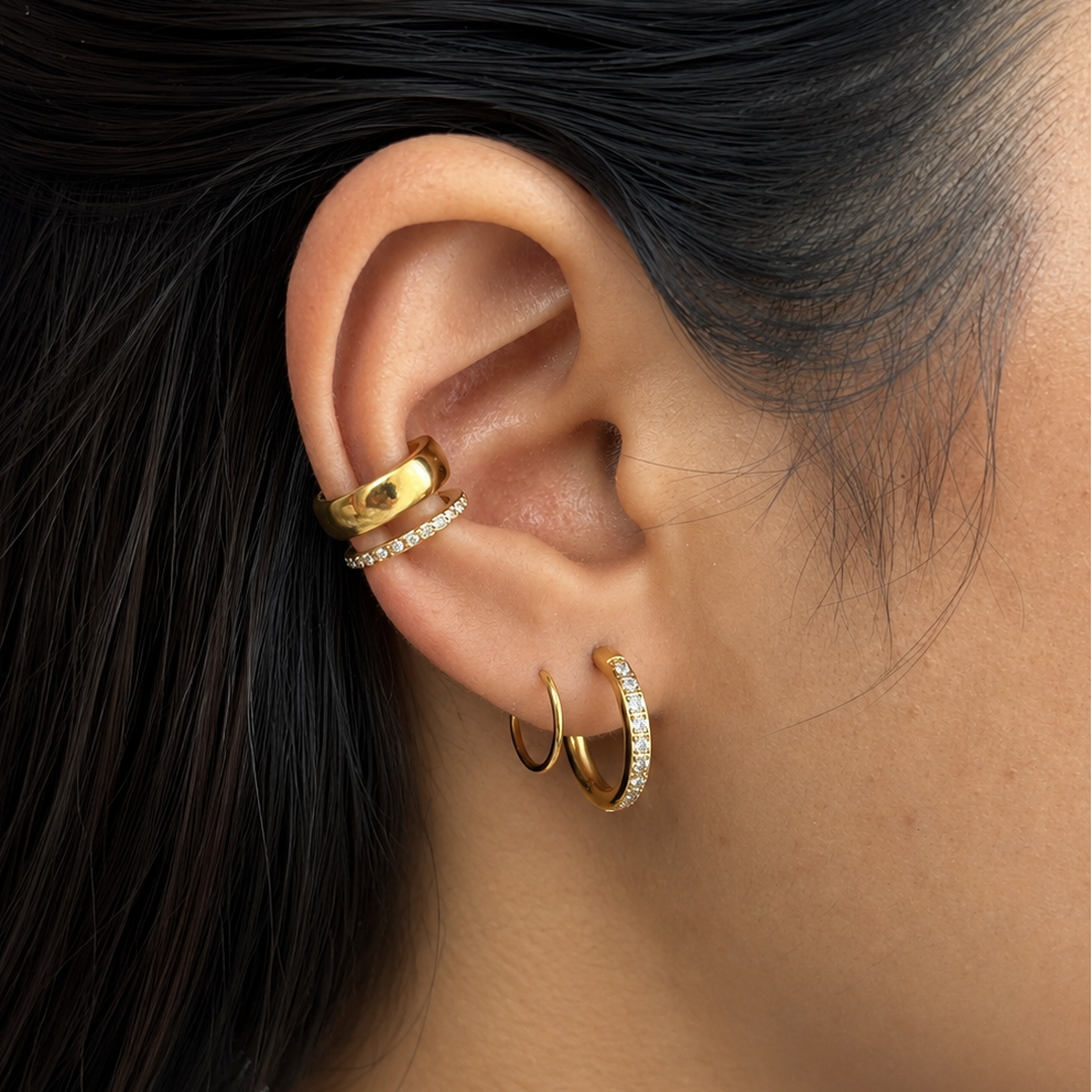 Coil Studded Hoops styled in an ear stack, showcasing the bold twisted silhouette and an elevated everyday glam vibe popular in India.
