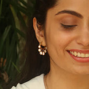 Opulent Elegance Combo adding timeless sparkle with crystal drop huggies and a modern ear cuff