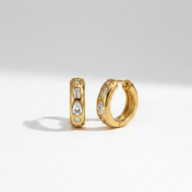 Crystal Charm Mini Hoops displaying a waterproof 18K gold-plated design with mixed-cut baguette and teardrop crystals crafted for daily wear in India.