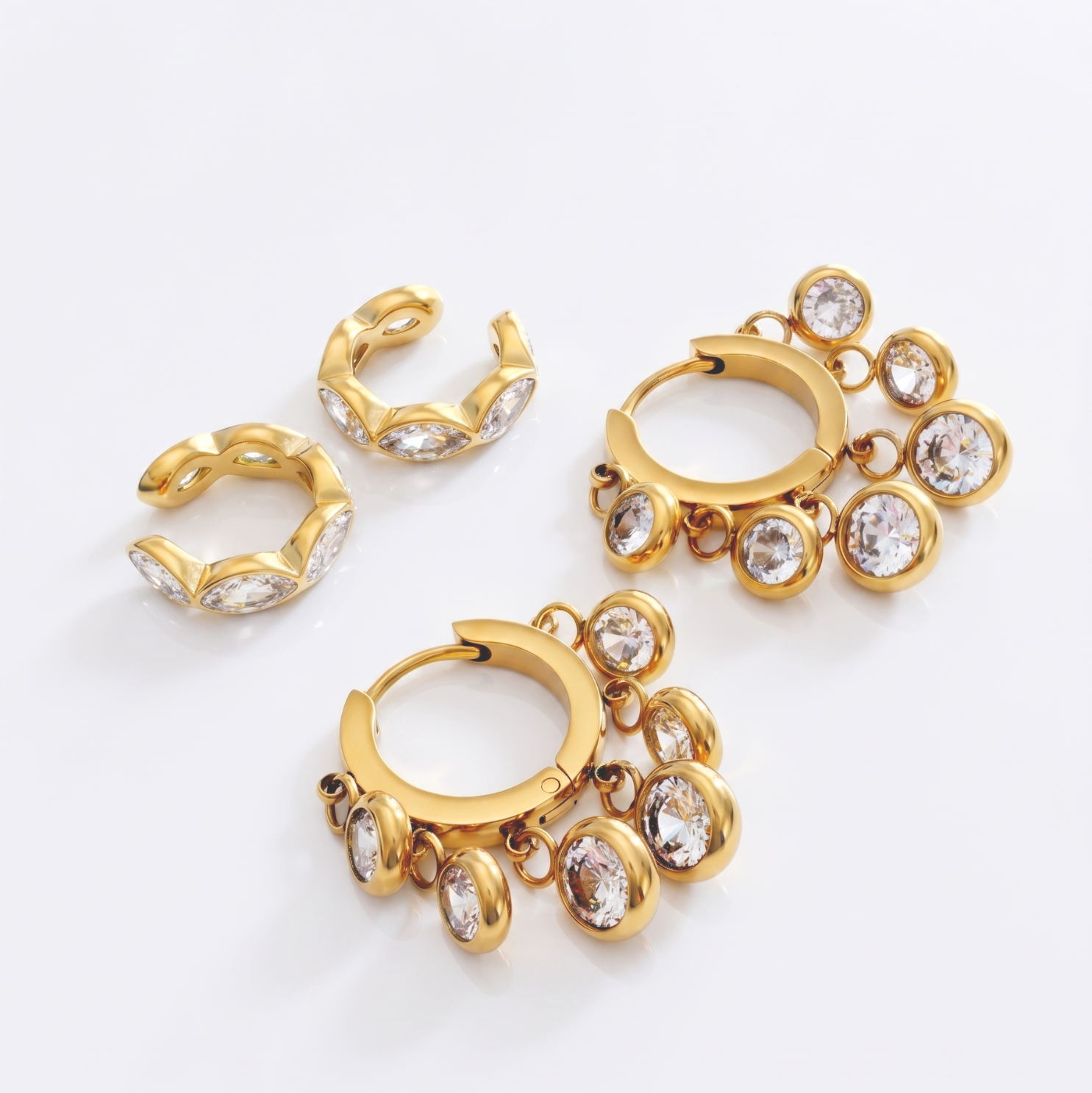 Dazzling Drops Combo bundling the waterproof Royal Exotic White Huggies and Dewdrop Ear Cuffs.
