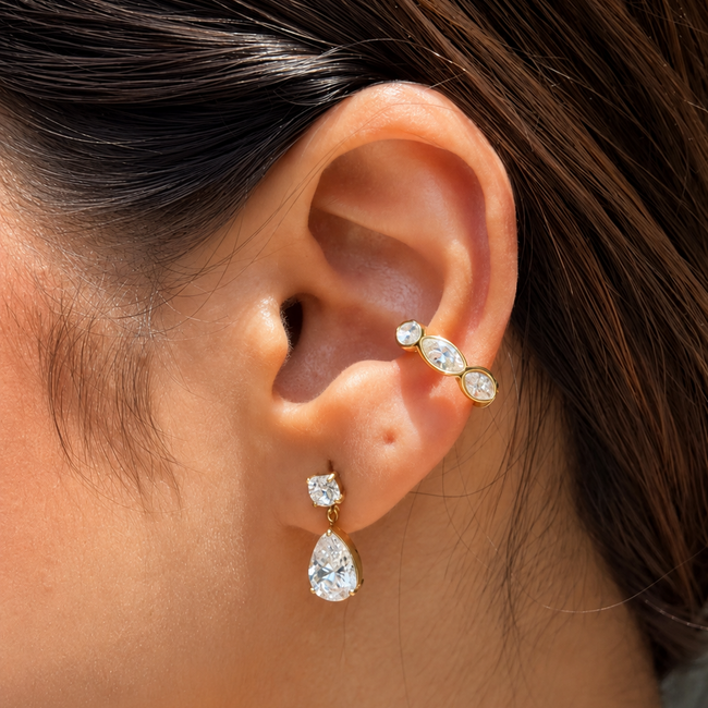 Dewdrop Studs styled on ear – sparkling teardrop earrings India