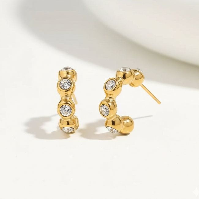 Eden Hoops revealing the durable anti-tarnish bubble structure and lightweight stud backing designed for a refined modern look in India.