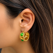 Emerald Studded Hoops styled to showcase a chic elevated look and the anti-tarnish durability popular in India.