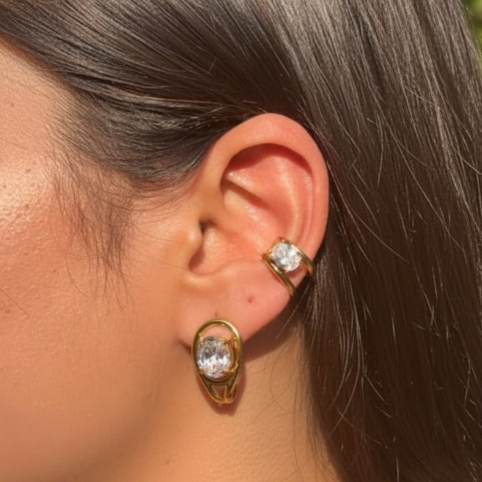 Close-up of gold oval stud earrings - waterproof jewellery India