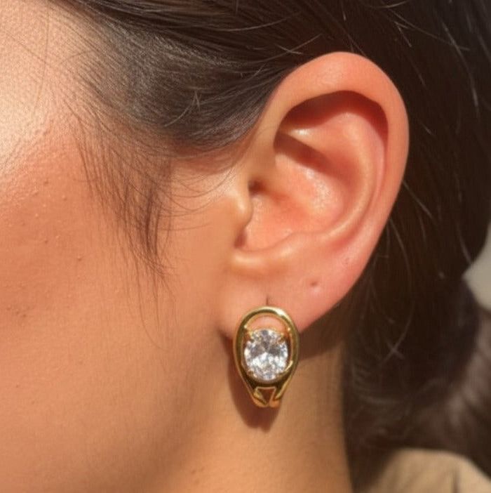 Oval gold studs worn by Indian woman - everyday office wear earrings India