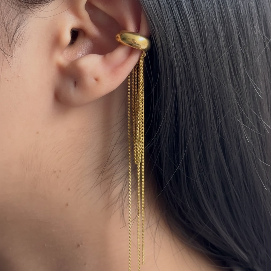 Gold tassel ear cuff worn by Indian woman - statement jewellery for festive and ethnic wear