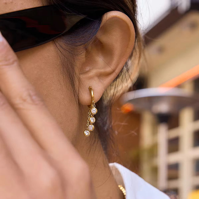 Iris drop earrings lifestyle photo – gold-plated elegant earrings buy online India