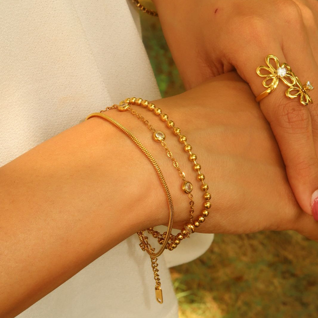 Ivory glow set on Indian woman's wrist - elegant pearl bracelet jewellery combo India