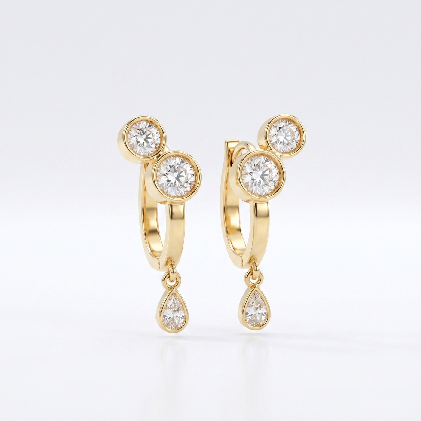 Office To Dinner Hoops featuring 18K gold bezel-set round crystals and a teardrop dangle.