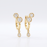 Office To Dinner Hoops featuring 18K gold bezel-set round crystals and a teardrop dangle.