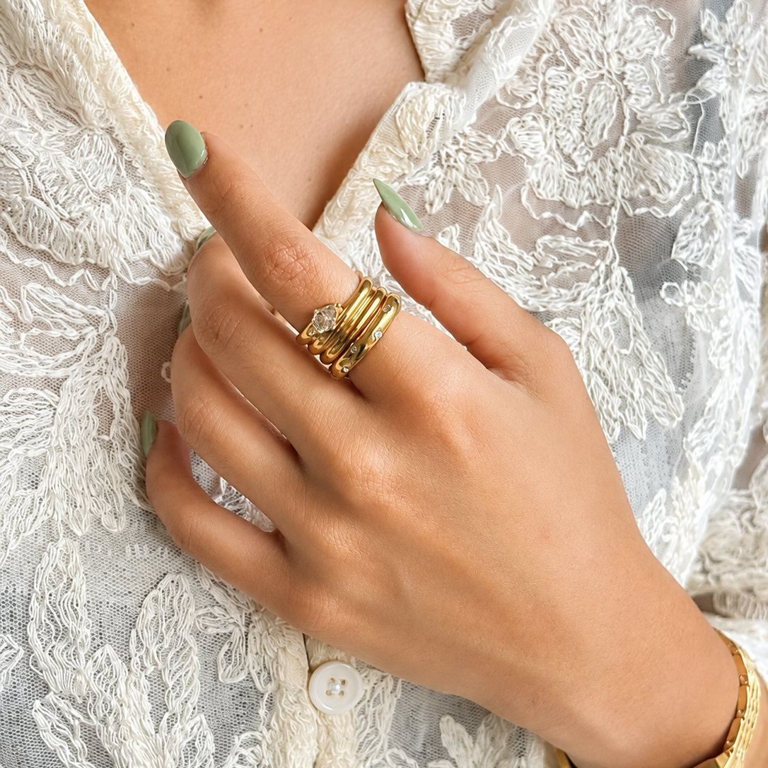 Opal Glow Ring styled on a hand alongside a minimal band, reflecting elegant everyday fashion trends in India.