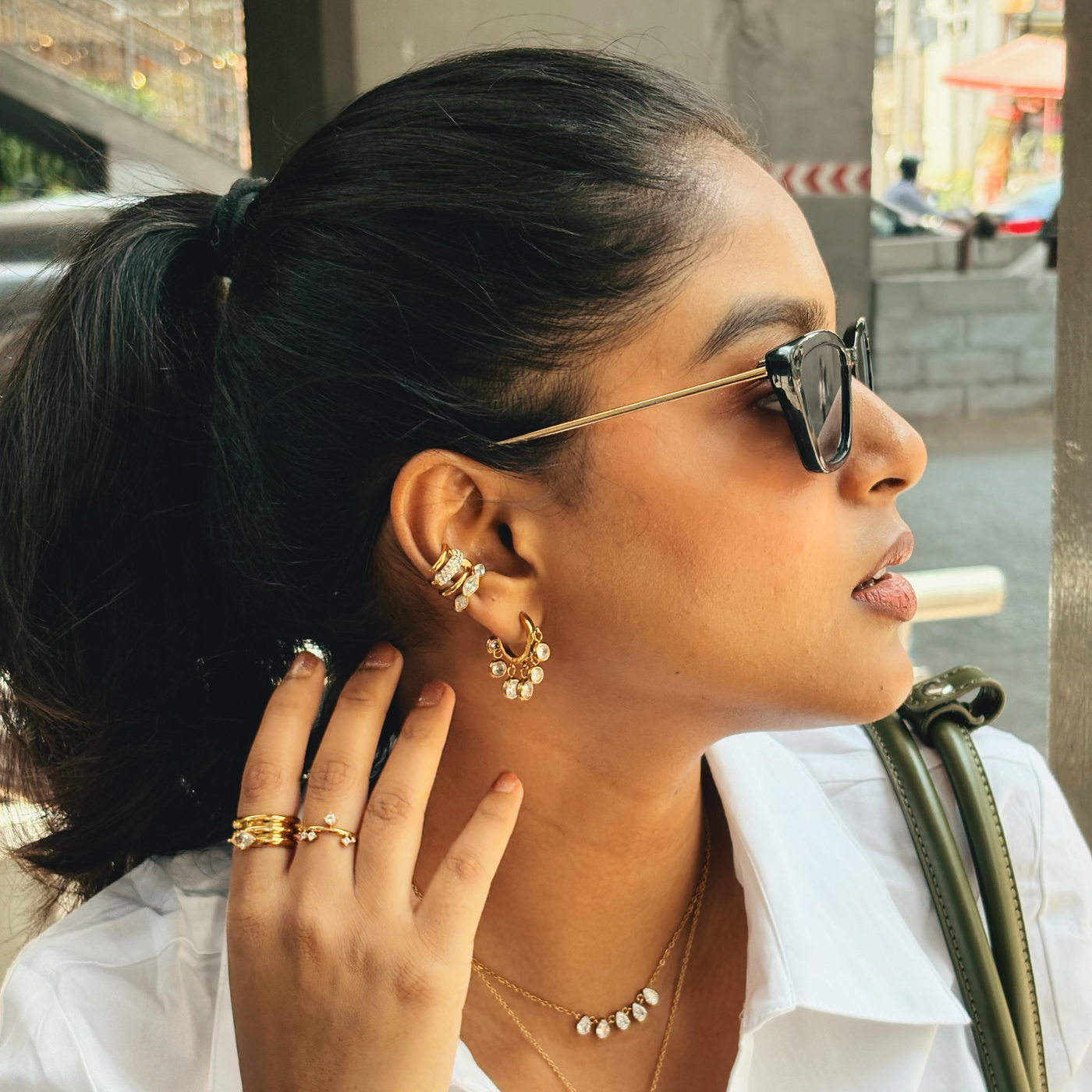Opal Glow Ring worn as part of a chic jewelry set by a woman outdoors, capturing a vibrant lifestyle look in India.