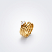 Opal Glow Ring in an angled close-up, highlighting the 18K gold-plated multi-band design and central marquise-cut stone.