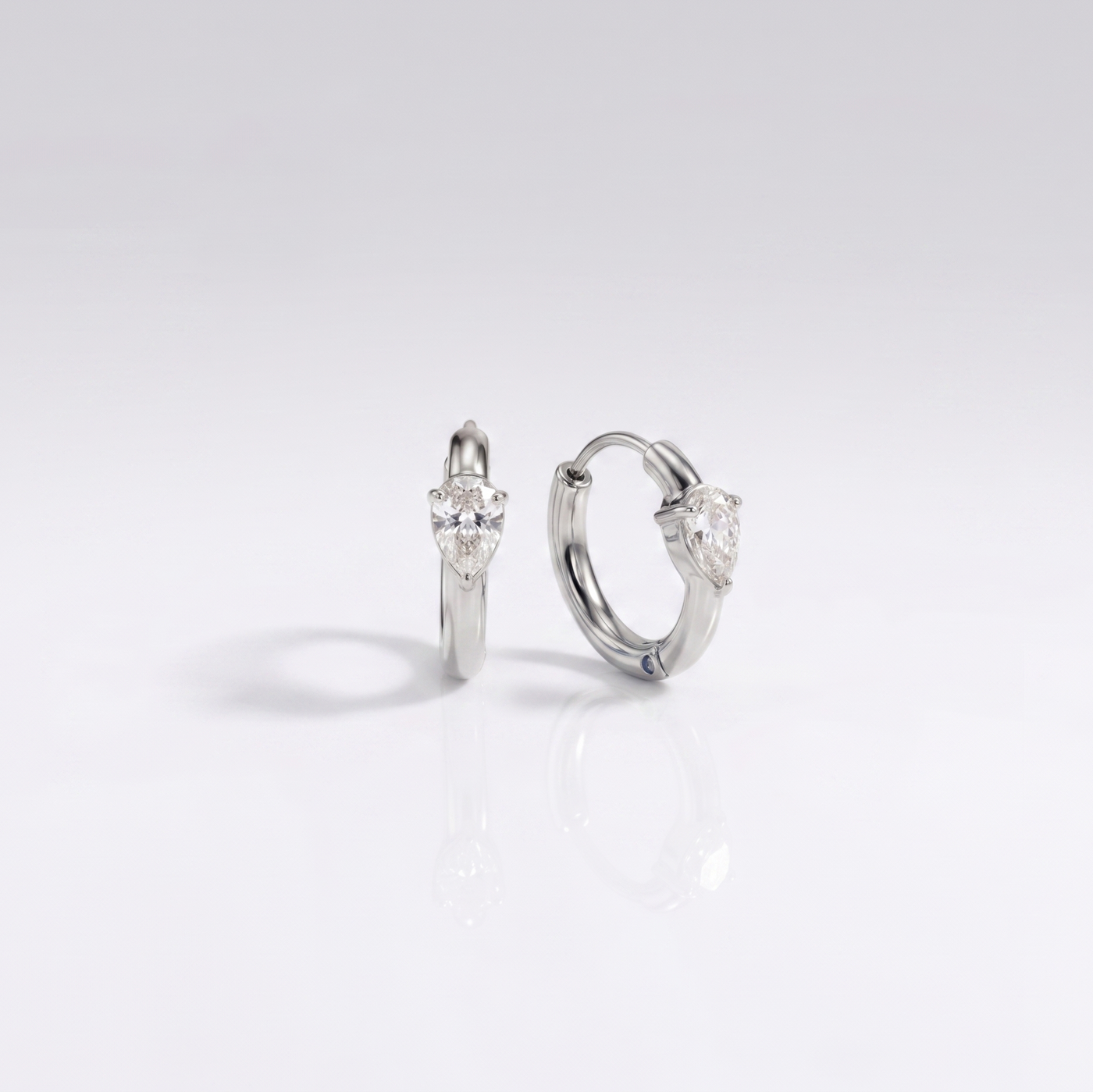 Opal Hoops displaying a waterproof silver finish with a luminous teardrop stone designed for everyday wear in India.