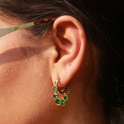 Eternal Emeralds Combo featuring emerald drop huggie earrings with gold-plated detailing and lasting shine