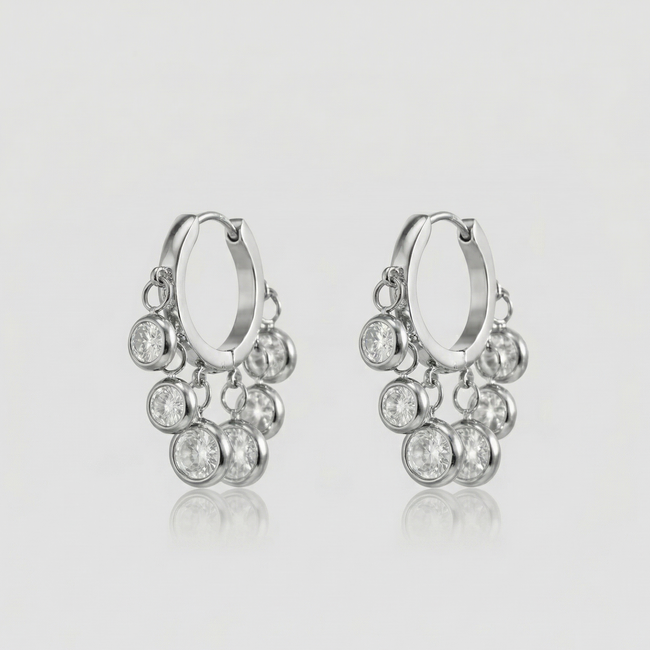 Royal Exotic Huggies Silver with sparkling cubic zirconia charms in a polished silver finish
