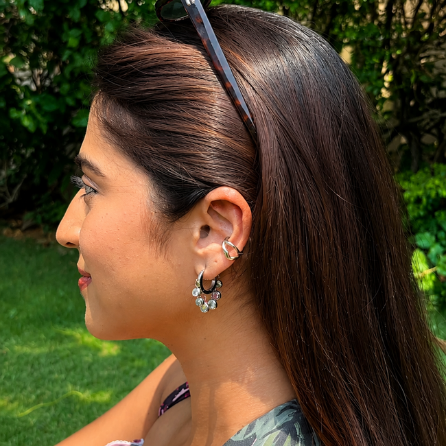 Royal Exotic Huggies Silver adding subtle sparkle to a minimal silver ear stack