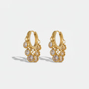 Royal Exotic Huggies Duo white zircon huggie earrings in 18k gold plating.