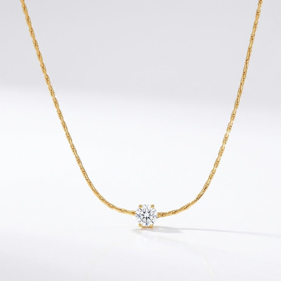 Solitaire Necklace displaying the 18K gold-plated chain and brilliant central stone designed for daily wear in India.