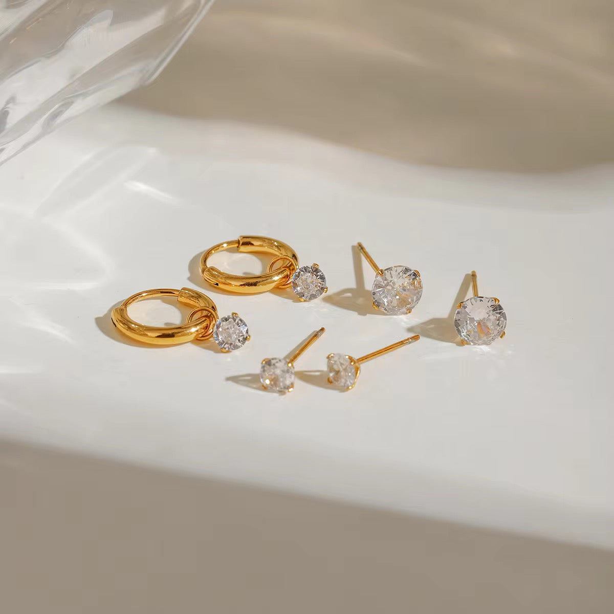 Stacked in Gold set – model wearing gold earring and cuff stack jewellery India
