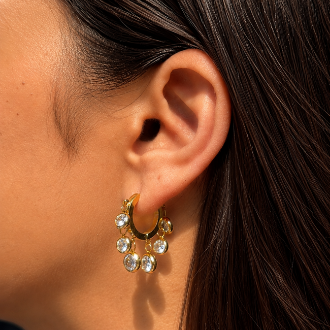 The Daily Stack styled with dangling Royal Exotic Huggies for elegant party wear.