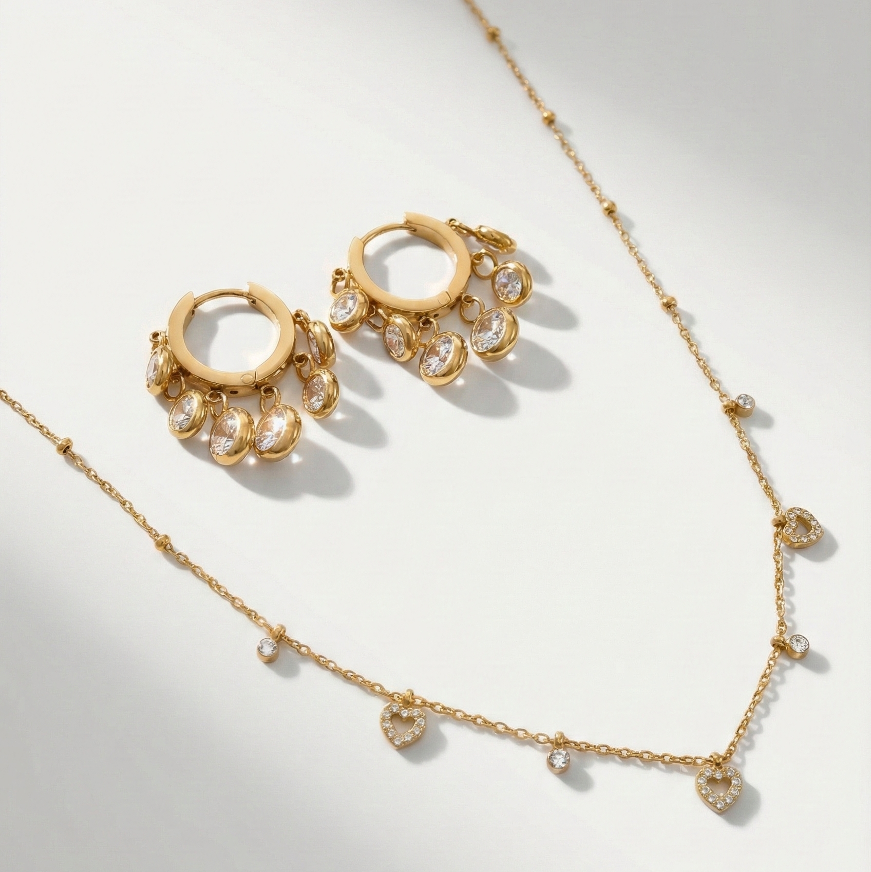 Tiny heart sparkle jewellery combo - gold heart earrings and bracelet set for women India