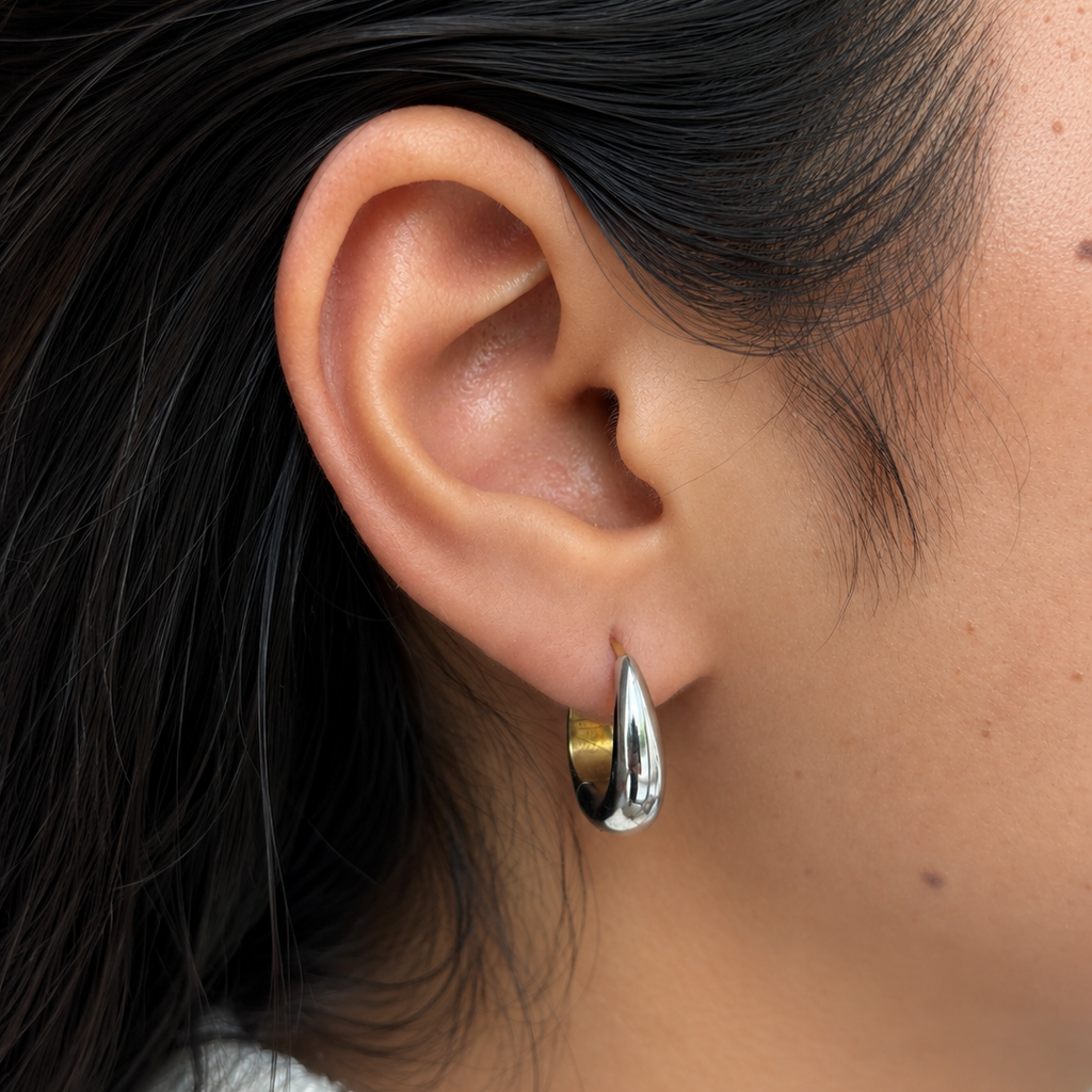 Yin and Yang Hoops styled on a model, showcasing the elegant mixed-metal fit and sleek modern aesthetic popular in India.