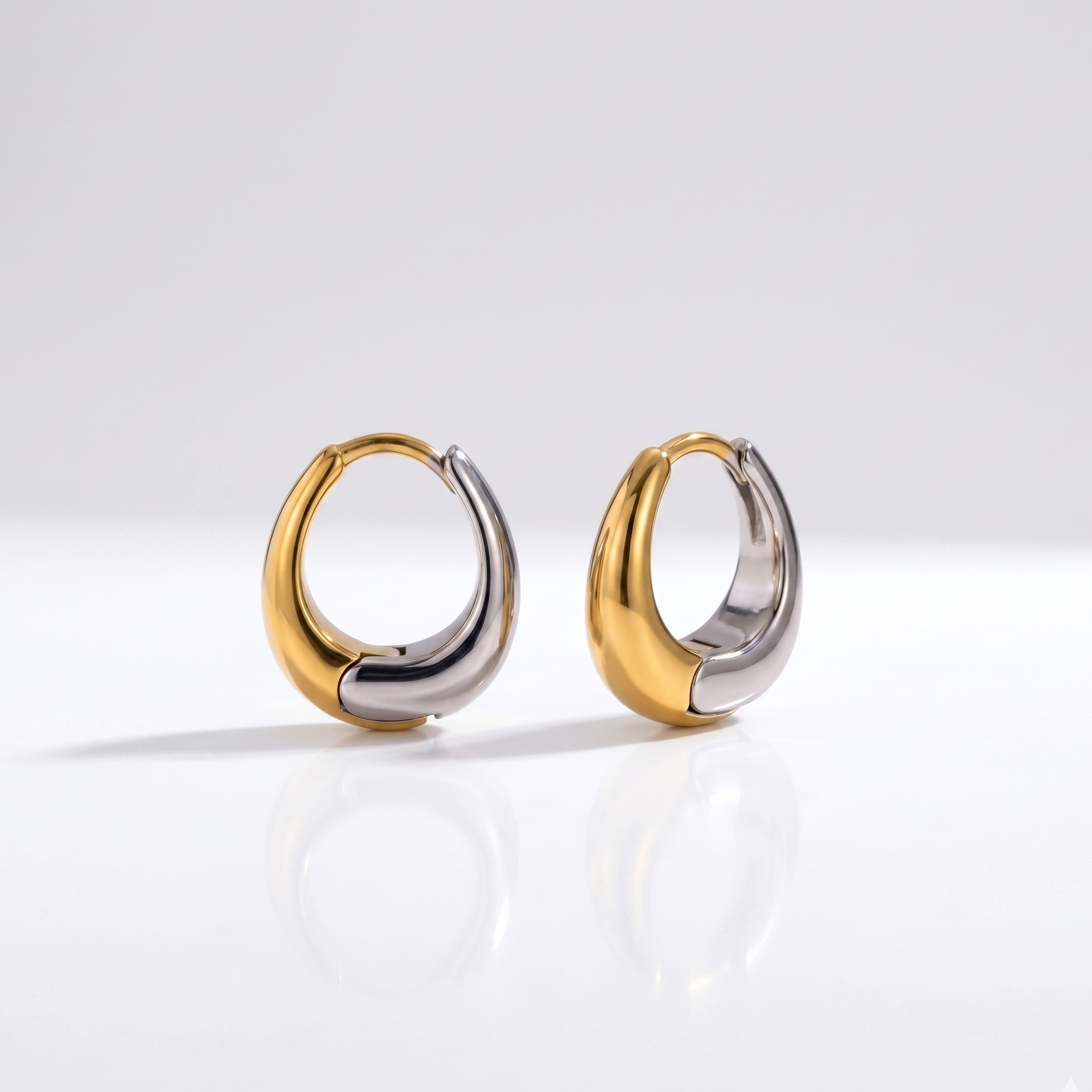 Yin and Yang Hoops displaying a bold two-tone design with half 18K gold-plated and half silver finishes crafted for daily wear in India.